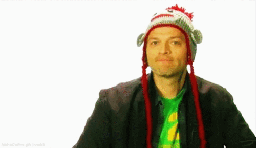 Misha giving the thumbs-up, wearing sock monkey hat